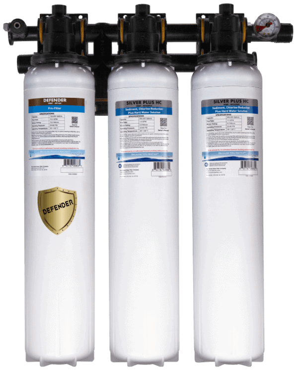 Three water filtration system units with black top and white body, labeled Defender and Silver Plus HC.