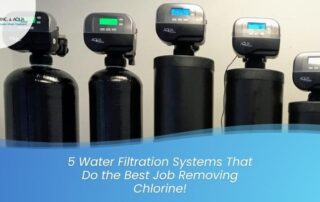 Five water filtration systems with digital controls on a wall.