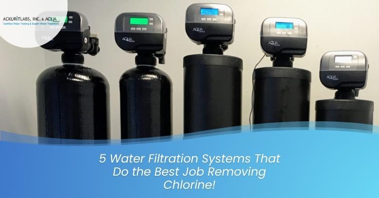 Five water filtration systems with digital controls on a wall.